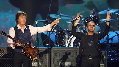 Paul McCartney and Ringo Starr perform at The Night that Changed America: A Grammy Salute to the Beatles in Los Angeles in January 2014. McCartney will induct Starr, his former Beatle bandmate, into the Rock and Roll Hall of Fame on April 18, 2015. Zach Cordner / Invision / AP