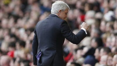 Stoke manager Mark Hughes celebrates after Bojan Krkic scored their first goal against Liverpool last weekend in the Premier League. Carl Recine / Action Images / Reuters / April 10, 2016