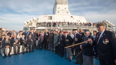Normandy veterans attend a at-sea wreath laying ceremony on the deck of the Brittany ferry from Portsmouth to Caen.