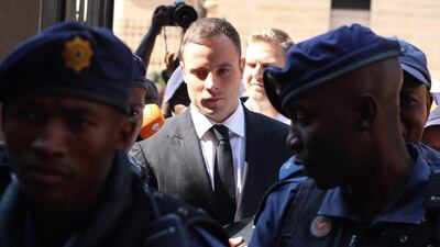South African Paralympic athlete Oscar Pistorius arrives at the High Court in Pretoria on October 13, 2014 as the sentencing phase of his trial begins. Mr Pistorius was convicted of culpable homicide in the killing of his girlfriend, Reeva Steenkamp on Valentine’s Day in 2013.Zinyange Auntony/AFP Photo
