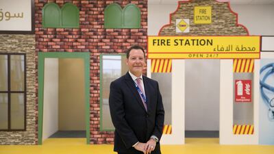 Gems Founders School Al Mizhar principal Nigel Cropley, at the school's Founders City, an example of the creative methods used to aid learning. Reem Mohammed / The National