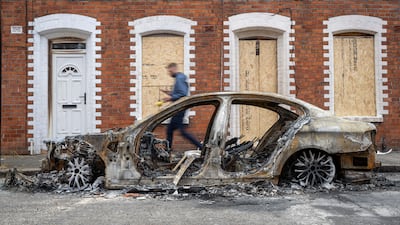 A burnt-out car. A 'hit list' of locations was shared on social media. EPA