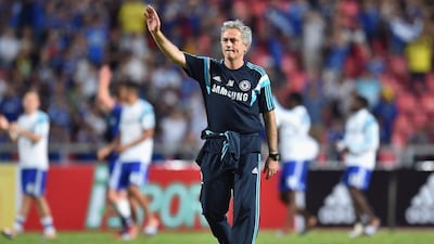 Chelsea manager Jose Mourinho waves to fans after a friendly match in Thailand last week. Thananuwat Srirasant / Getty Images / May 30, 2015