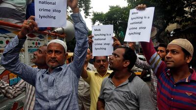 People hold placards and block a road during a protest against recent mob lynchings across the country, in Kolkata, India. Rupak De Chowdhuri / Reuters