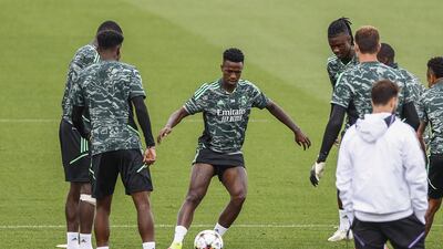 Real Madrid attacker Vinicius Junior passes the ball during training. EPA