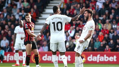 Bruno Fernandes of Manchester United celebrates scoring his team's first goal with teammate Marcus Rashford. Getty Images