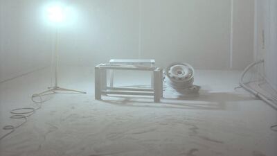 Blasting media, paint and dust hang in the air after a job is completed.