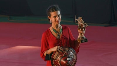 Aida Benelkadir, a representative for Somali director Khadar Ayderus Ahmed, poses with the Stallion of Yennenga Grand Prize trophy for 'The Gravedigger's Wife' at the 27th Pan-African Film and Television Festival of Ouagadougou. AFP