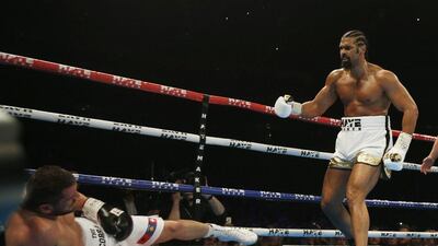 David Haye, right, sends Arnold Gjergjaj crashing to the canvas during their heavyweight contest at London's 02 Arena. Andrew Couldridge / Action Images