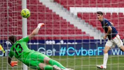 Ante Budimir scores the opening goal for Osasuna against Atletico Madrid. AP