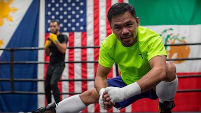 Manny Pacquiao stretches ahead of an afternoon training session at Wild Card Boxing in Los Angeles. AFP