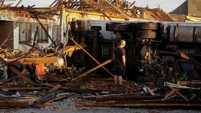A man surveys the damage a day after a rare tornado struck the village of Moravska Nova Ves in the Czech Republic on June 24, 2021. Reuters