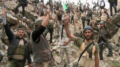 Free Syrian Army fighters shout "Allahu Akbar" near Deraa in this still image taken from a video obtained by Reuters on Thursday.