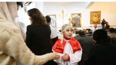 Iraqi Christians pray during an evening mass in Amman. Salah Malkawi for The National