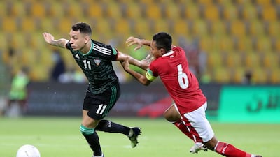 Caio Canedo of the UAE battles with Evan Dimas Darmono of Indonesia. Chris Whiteoak / The National