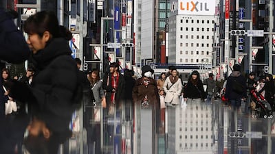 People walk on a street at Tokyo's Ginza shopping district on February 15, 2015. Japan's economy rebounded from recession to grow an annualized 2.2 per cent in the final quarter of last year, giving a much-needed boost to premier Shinzo Abe's efforts to shake off decades of stagnation even as the global outlook deteriorates. Yuya Shino / Reuters