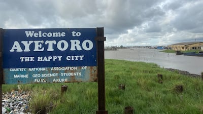 A sign welcoming visitors to the sinking 'happy' city