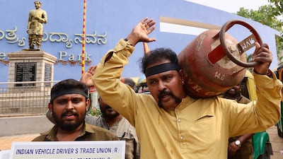 Indian auto rickshaw drivers protest over shortages of liquefied petroleum gas in Bangalore on Tuesday. Iran’s strongarming of the world economy has created an LPG supply crisis in several countries. EPA
