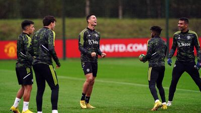 Cristiano Ronaldo laughs with Manchester United teammates at the AON Training Complex on Wednesday. PA