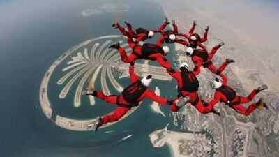 Eight members of the British army's elite parachuting team fall in formation over the Palm Jumeirah. The jump, which included a maiden dive by the British ambassador and five of his staff, raised Dh20,000 for charities in the two countries.