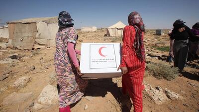 Generous donations from individuals and companies in the UAE have allowed workers from the UAE Red Crescent to continue their summer relief work in Syrian refugee camps into the harsh winter, which is affecting areas such as the Bekaa Valley in Lebanon. Salah Malkawi for The National