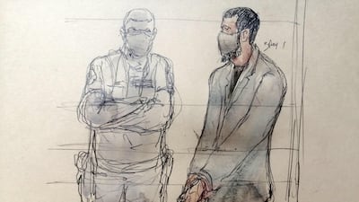 This court sketch shows Salah Abdeslam flanked by a policeman during the trial taking place at the Palais de Justice of Paris. AFP