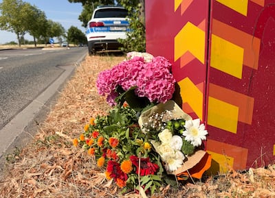 Flowers laid at the spot where a student was killed in a knife attack by an Afghan citizen on a street in Trier, Germany. AFP