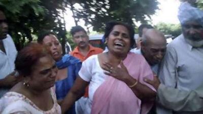 Relatives react outside Anandpur Sahib Civil hospital in the northern state of Punjab, India, where those killed and injured in the stampede were taken.