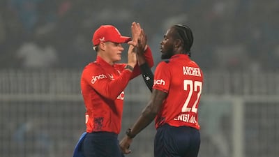 England's Jofra Archer, right, after taking the wicket of India captain Suryakumar Yadav. AP