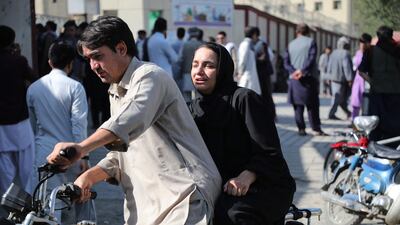 A woman arrives at a hospital in Kabul to look for a relative after the attack. AFP