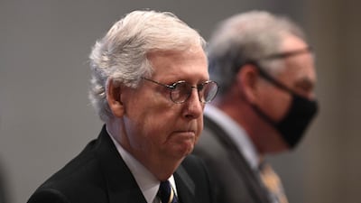 US Senate Minority Leader Mitch McConnell arrives for the service. AFP