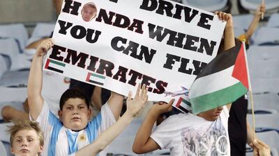 A UAE fan holds up a placard during the Asian Cup quarter-final match between the UAE and Japan on Friday in Sydney. Jason Reed / Reuters