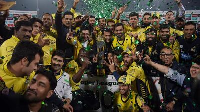 Cricketers of Peshawar Zalmi celebrate their victory over Quetta Gladiators in the final cricket match of the Pakistan Super League at Gaddafi Stadium in Lahore on Sunday. Aaamir Qureshi / AFP