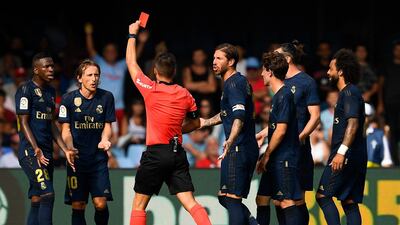 Referee Estrada Fernandez shows a red card to Luka Modric. Getty Images