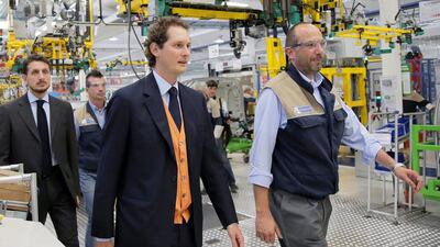 Italian automaker Fiat’s chairman John Elkann (left) visits the Maserati assembly line. MARCO BERTORELLO / AFP