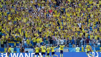 Andreas Granqvist, left, celebrates after Sweden's decisive penalty against South Korea. Lee Jin-man / AP Photo