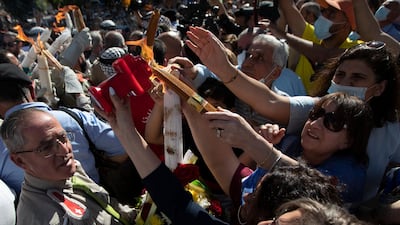 Palestinian Christians light candles during the Holy Fire ceremony in the West Bank city of Ramallah on May 1, 2021. The Holy Fire ceremony is part of Orthodox Easter rituals and the flame symbolises the resurrection of Christ. AP Photo