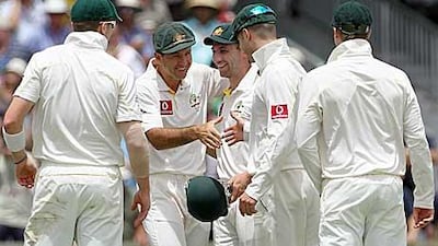 Ricky Ponting, second left, congratulates his teammates on Australia's victory over England yesterday after he had missed the final day's play because of a broken little finger.