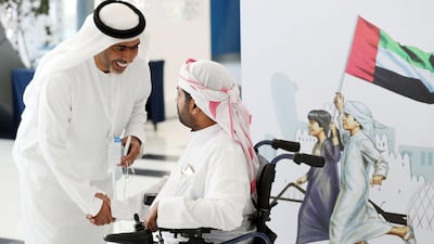 An Emirati arrives at Adnec to cast his vote on Tuesday. Chris Whiteoak / The National