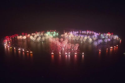 Record-breaking fireworks explode in the sky over the World Islands on January 1, 2014. Reuters