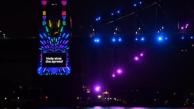 The Sydney Harbour Bridge pylon is lit with a Covid-19 safe message ahead of midnight fireworks during New Year's Eve celebrations in Sydney, New South Wales, Australia. EPA