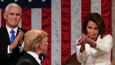 TOPSHOT - US President Donald Trump arrives to deliver the State of the Union address, alongside Speaker of the House Nancy Pelosi and Vice President Mike Pence,at the US Capitol in Washington, DC, on February 5, 2019. / AFP / POOL / Doug Mills