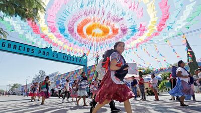 Mexican women in traditional dress participate in the Tortilla Race in Santa Maria Coapan, Puebla, Mexico. EPA