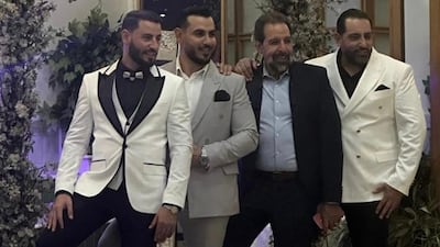 Ahmed Farhat, second right, with his sons, before his detention and assassination in Syria last year. Photo: Supplied