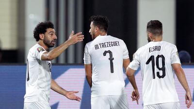 Egypt's Mohamed Salah celebrates with teammate Mahmoud 'Trezeguet' Hassan after scoring against Uganda. EPA