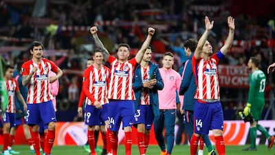 Atletico Madrid players celebrate reaching the Europa League final after a 2-1 aggregate victory over Arsenal. Juanjo Martin / EPA