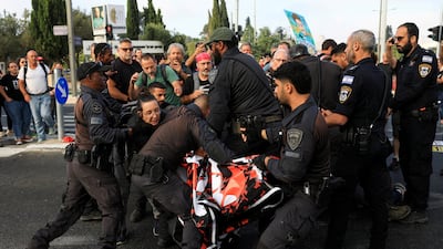 Protesters block a road and clash with police outside the Knesset, Israel's parliament. Reuters