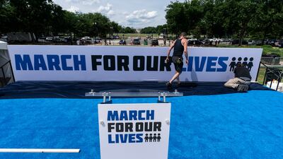 Workers set up for the March for Our Lives rally on the National Mall in Washington, on June 10, 2022. AP