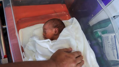 A premature Palestinian baby is evacuated from Al Helal International Hospital to be transported to a hospital in southern Gaza for specialist medical care. Reuters