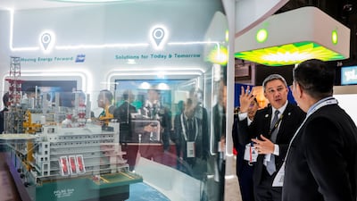People visit the booth of Malaysian energy group Pentronas during Gastech in Bangkok earlier this month. Reuters